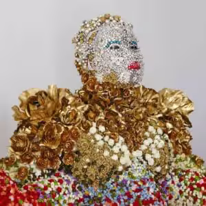 Detailed beadwork and floral textures in "Approved Model of the New Azania" by Athi-Patra Ruga.
